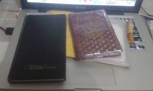 My passport, a small pouch for documents , and a tiny pen. Always carry a pen when traveling. More often, you have to fill up some forms for international airports.  Also, I carry with my a small notebook for expense tracking, and also just for taking notes of foreign sounding name of food,.