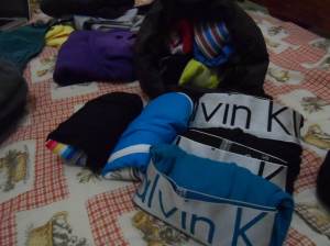 Rolled underwear, placed inside a sipped fabric pouch, which also serves as my pillow. I don't carry a neck pillow anymore since it uses up a lot of my bag.