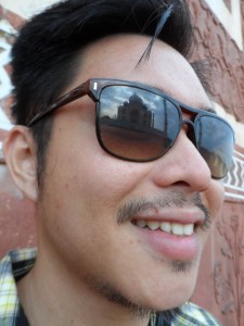 Reflection of Taj on my Sunglasses , as composed by the indian local who helped me take epic jump shots . 