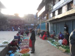The corners of Nyalapola Temple square are occupied by vegetable and spice vendors in the morning